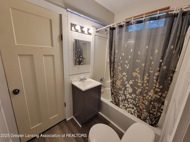 1201 Climax St, Lansing, MI 48912 - bathroom featuring shower / bath combo, vanity, and wood finished floors