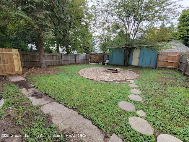 1201 Climax St, Lansing, MI 48912 - fenced backyard with a fire pit and a gate