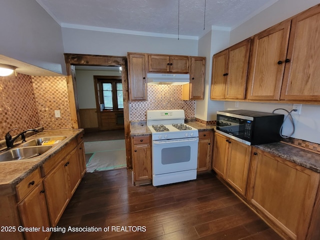 1201 Climax St, Lansing, MI 48912 - kitchen featuring gas range gas stove, under cabinet range hood, black microwave, crown molding, and dark wood-type flooring