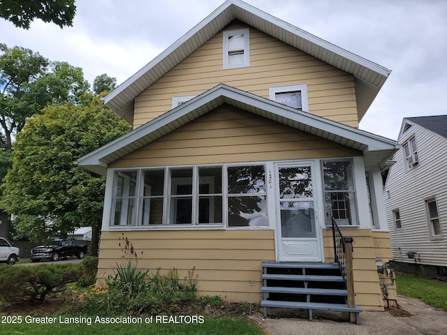 1201 Climax St, Lansing, MI 48912 - view of front of home featuring entry steps and a sunroom
