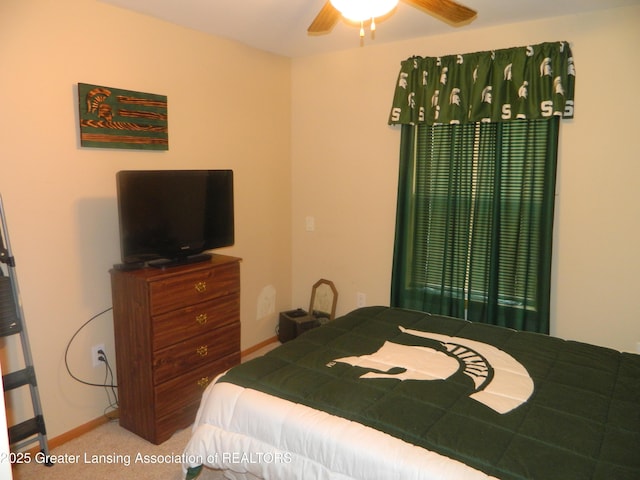 202 Broadway Rd, Houghton Lake, MI 48629 - carpeted bedroom featuring baseboards and a ceiling fan