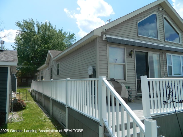 202 Broadway Rd, Houghton Lake, MI 48629 - rear view of house featuring a deck