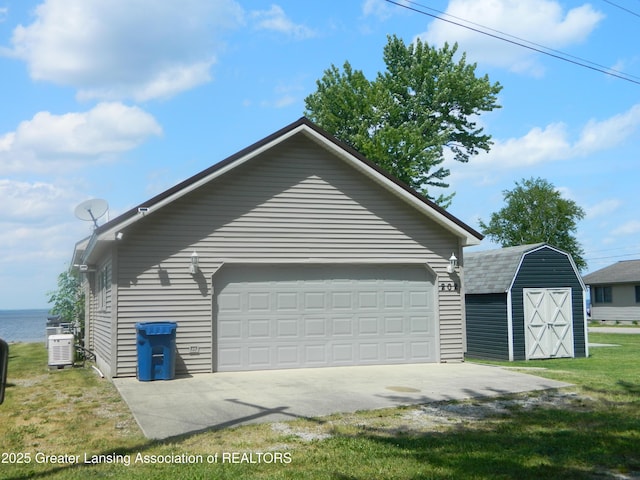 202 Broadway Rd, Houghton Lake, MI 48629 - detached garage featuring a storage shed