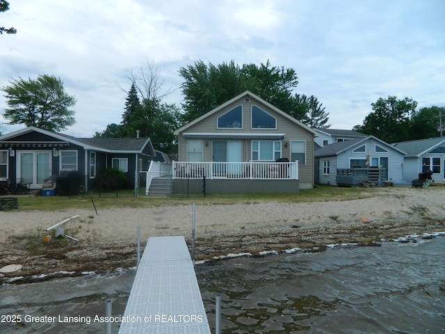 202 Broadway Rd, Houghton Lake, MI 48629 - view of front of property with a wooden deck