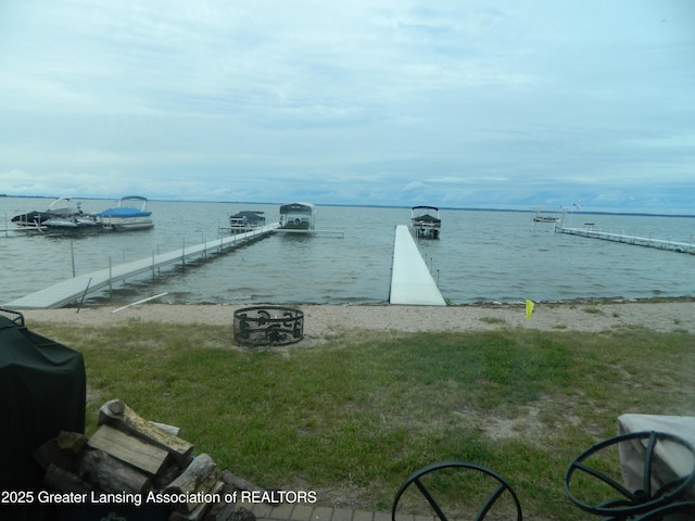 202 Broadway Rd, Houghton Lake, MI 48629 - water view with a fire pit and a boat dock