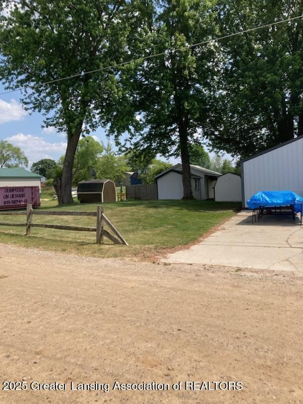 4701 W Channel Dr, Stanton, MI 48888 - view of yard with a storage shed