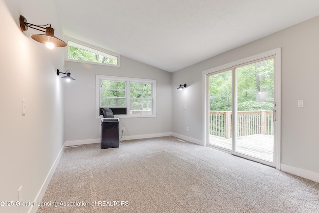 9481 S Clinton Trl, Eaton Rapids, MI 48827 - unfurnished living room featuring carpet floors, a desk, and lofted ceiling