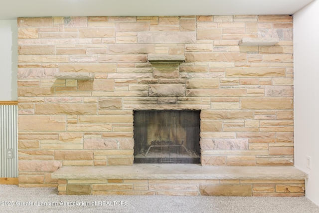 9481 S Clinton Trl, Eaton Rapids, MI 48827 - detailed view of carpet floors and a stone fireplace