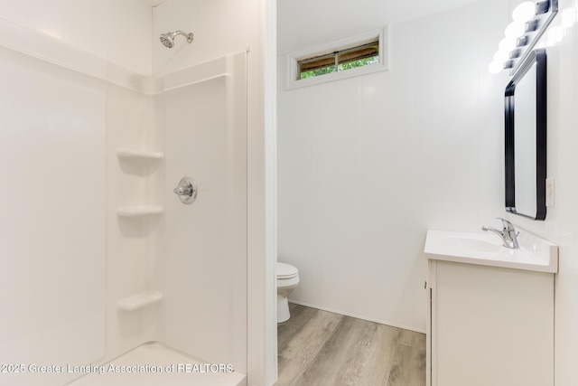 9481 S Clinton Trl, Eaton Rapids, MI 48827 - full bath with vanity, wood finished floors, and a shower