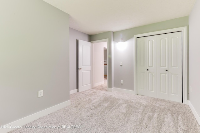 9481 S Clinton Trl, Eaton Rapids, MI 48827 - unfurnished bedroom with carpet and a closet