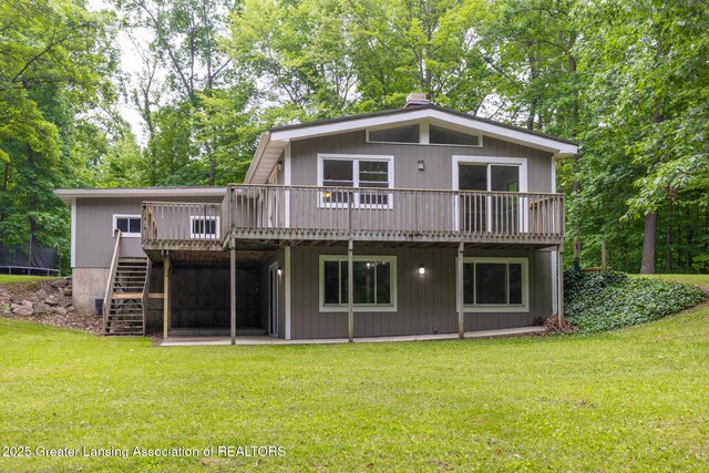 9481 S Clinton Trl, Eaton Rapids, MI 48827 - back of house with a wooden deck, stairs, and a lawn