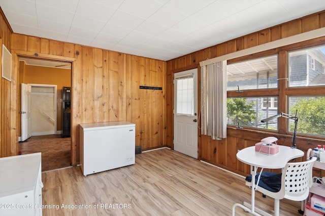 209 N Bowen St, Jackson, MI 49202 - dining space featuring wood walls and wood finished floors