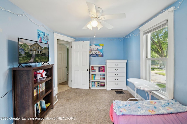 209 N Bowen St, Jackson, MI 49202 - carpeted bedroom featuring a ceiling fan