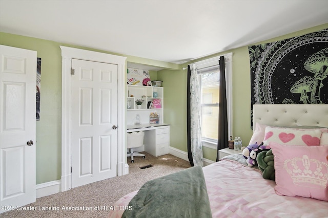 209 N Bowen St, Jackson, MI 49202 - carpeted bedroom with baseboards and a desk