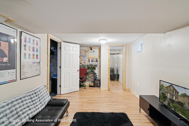 209 N Bowen St, Jackson, MI 49202 - living area featuring light wood-type flooring and baseboards