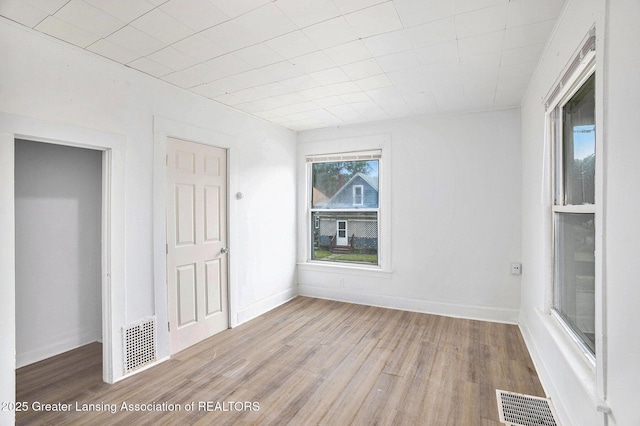 147 Isbell St, Lansing, MI 48910 - unfurnished bedroom featuring wood finished floors