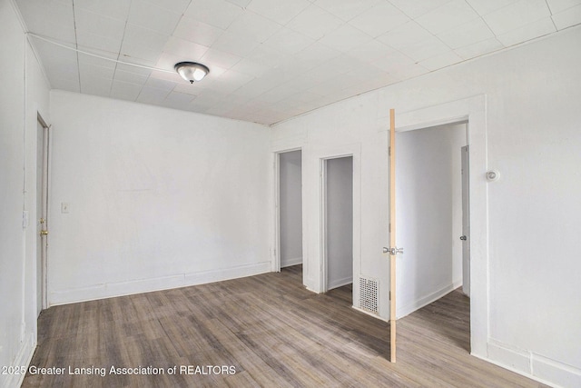 147 Isbell St, Lansing, MI 48910 - unfurnished room with wood finished floors and baseboards