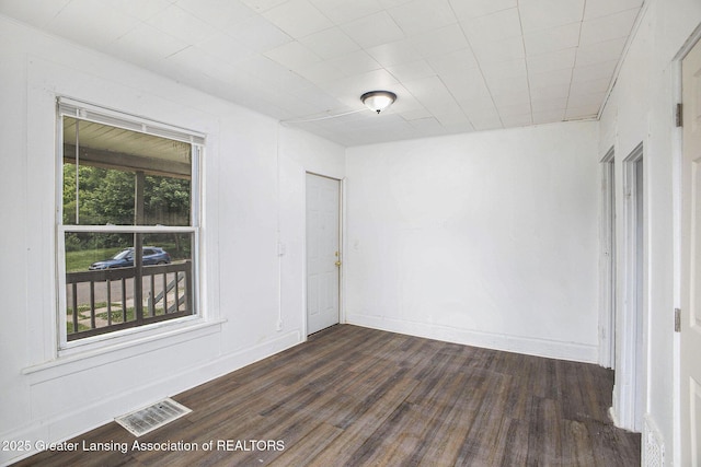 147 Isbell St, Lansing, MI 48910 - spare room with dark wood-type flooring