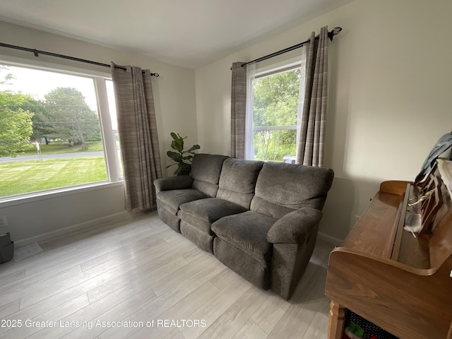 4175 Marshall Rd, Charlotte, MI 48813 - living area featuring baseboards and light wood-style floors