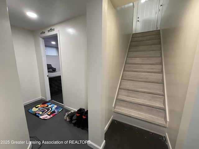 4175 Marshall Rd, Charlotte, MI 48813 - stairs featuring baseboards and finished concrete flooring