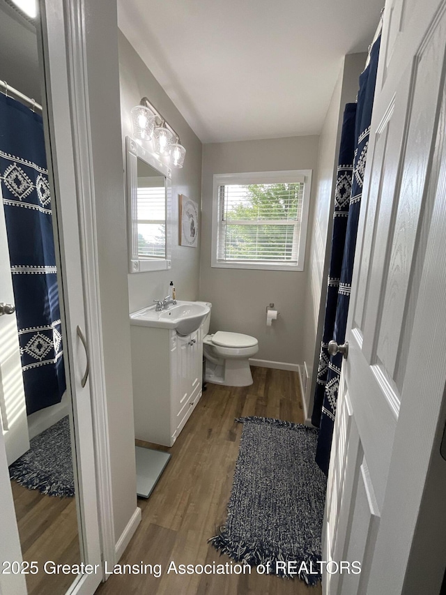 4175 Marshall Rd, Charlotte, MI 48813 - full bath with wood finished floors and vanity