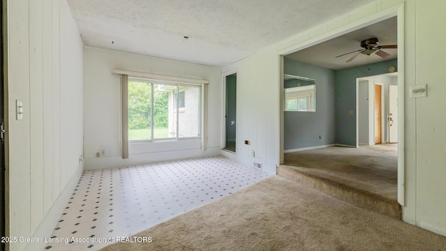 62 W Sherwood Rd, Okemos, MI 48864 - carpeted spare room featuring a textured ceiling and a ceiling fan