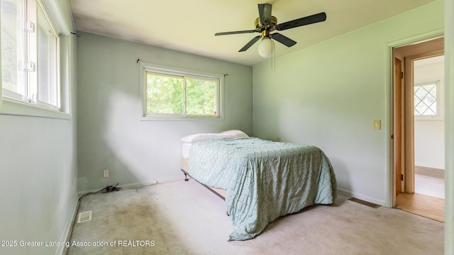 62 W Sherwood Rd, Okemos, MI 48864 - bedroom with carpet and a ceiling fan