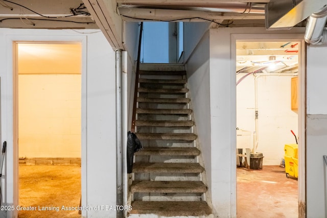 62 W Sherwood Rd, Okemos, MI 48864 - staircase with concrete floors