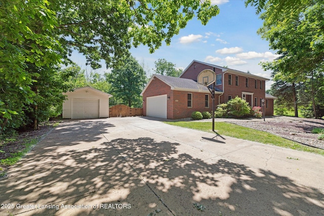 4084 Hulett Rd, Okemos, MI 48864 - view of front of property featuring brick siding and a garage