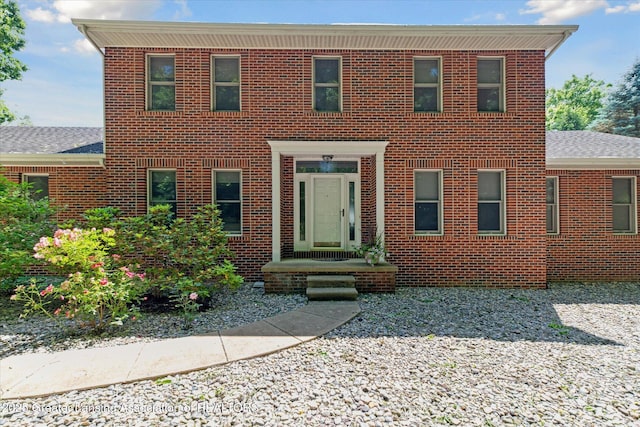4084 Hulett Rd, Okemos, MI 48864 - view of front of home featuring brick siding and a shingled roof