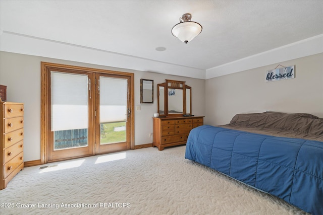 4084 Hulett Rd, Okemos, MI 48864 - bedroom featuring access to exterior and carpet floors