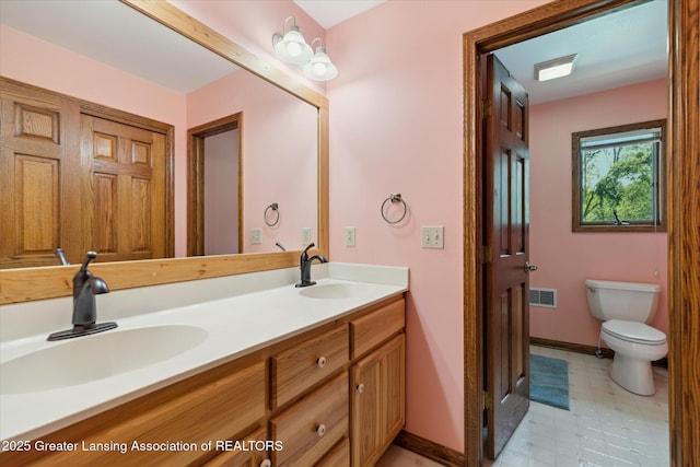 4084 Hulett Rd, Okemos, MI 48864 - bathroom with double vanity and tile patterned floors