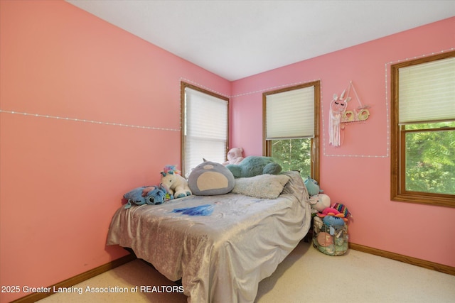 4084 Hulett Rd, Okemos, MI 48864 - carpeted bedroom with baseboards