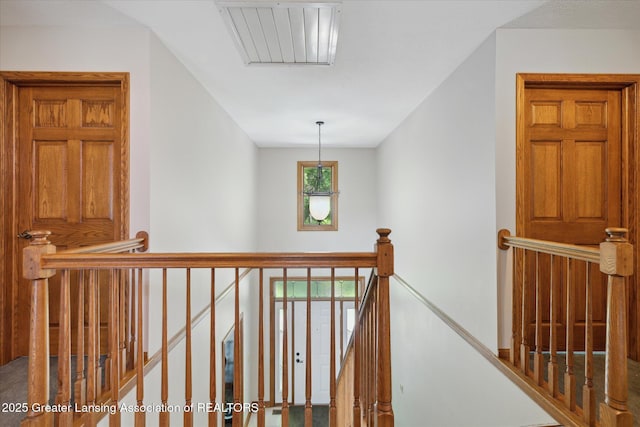 4084 Hulett Rd, Okemos, MI 48864 - hallway featuring an upstairs landing