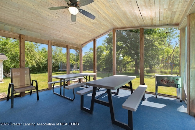 4084 Hulett Rd, Okemos, MI 48864 - sunroom / solarium with a ceiling fan, healthy amount of natural light, view of wooded area, and lofted ceiling