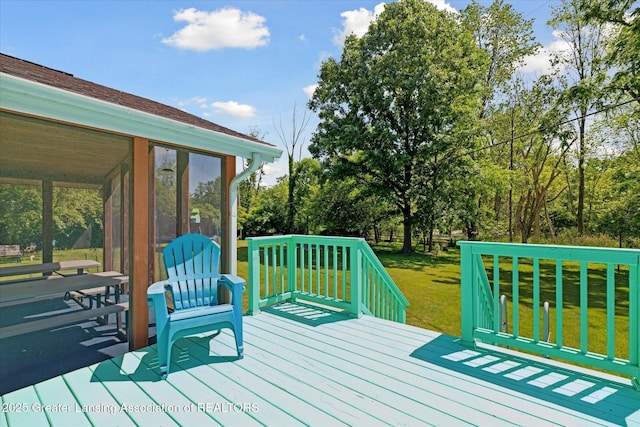 4084 Hulett Rd, Okemos, MI 48864 - wooden terrace featuring a sunroom, a yard, and view of scattered trees