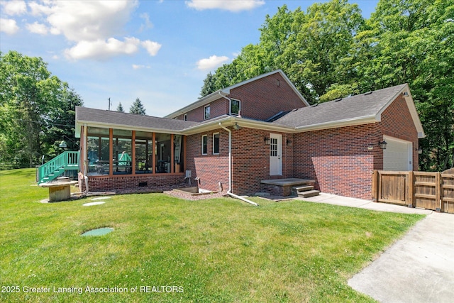 4084 Hulett Rd, Okemos, MI 48864 - view of front of home featuring an attached garage, a sunroom, brick siding, and a shingled roof
