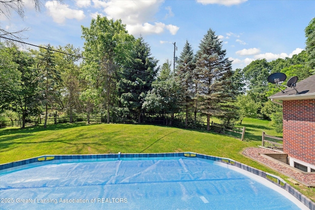 4084 Hulett Rd, Okemos, MI 48864 - outdoor pool featuring view of scattered trees