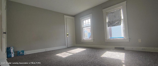 1017 W Oakland Ave, Lansing, MI 48915 - unfurnished room featuring carpet floors and baseboards