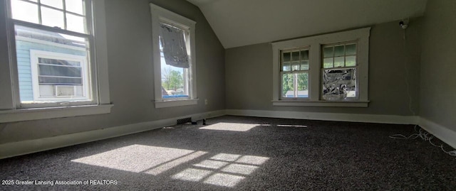 1017 W Oakland Ave, Lansing, MI 48915 - empty room featuring carpet flooring and lofted ceiling