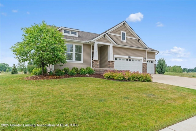 11167 Windswept Dr, Grand Ledge, MI 48837 - craftsman-style home with concrete driveway, a front lawn, stone siding, and a shingled roof