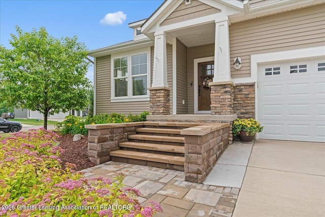 11167 Windswept Dr, Grand Ledge, MI 48837 - entrance to property with stone siding, a porch, and driveway