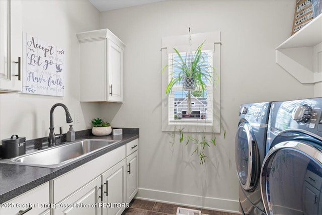 11167 Windswept Dr, Grand Ledge, MI 48837 - washroom featuring independent washer and dryer, cabinet space, and dark wood-style flooring