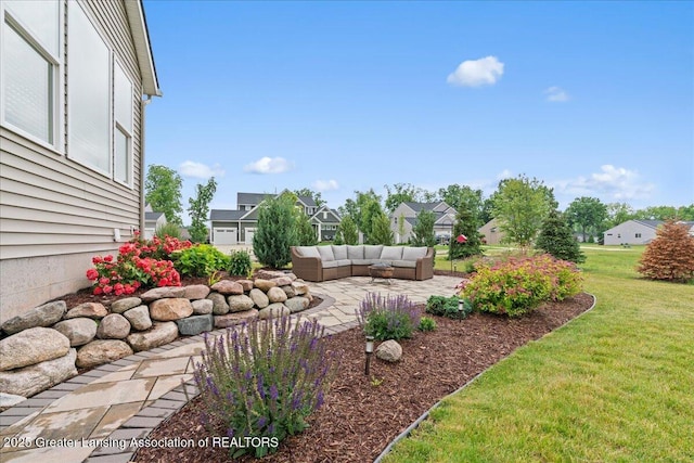 11167 Windswept Dr, Grand Ledge, MI 48837 - view of grassy yard featuring outdoor lounge area, a patio area, and a residential view