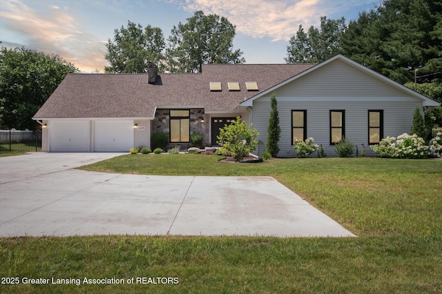2605 College Rd, Holt, MI 48842 - view of front of house with a shingled roof, concrete driveway, an attached garage, and a chimney