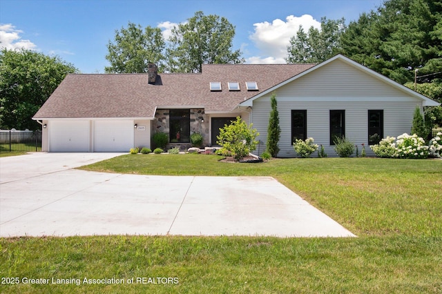 2605 College Rd, Holt, MI 48842 - view of front of home featuring roof with shingles, concrete driveway, an attached garage, and a chimney