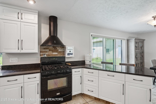 2605 College Rd, Holt, MI 48842 - kitchen with black gas range oven, wall chimney exhaust hood, dark countertops, and a textured ceiling