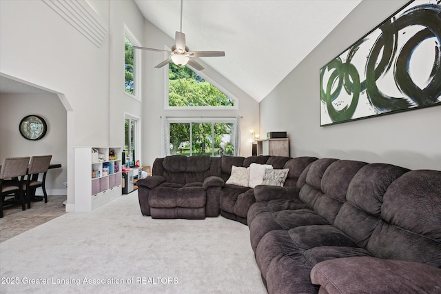 2605 College Rd, Holt, MI 48842 - carpeted living area with high vaulted ceiling and a ceiling fan