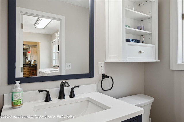 2605 College Rd, Holt, MI 48842 - bathroom with toilet and vanity