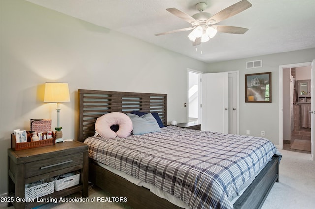 2605 College Rd, Holt, MI 48842 - carpeted bedroom with a ceiling fan